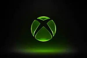 شعار XBOX الأخضر البارز على خلفية سوداء مظلمة